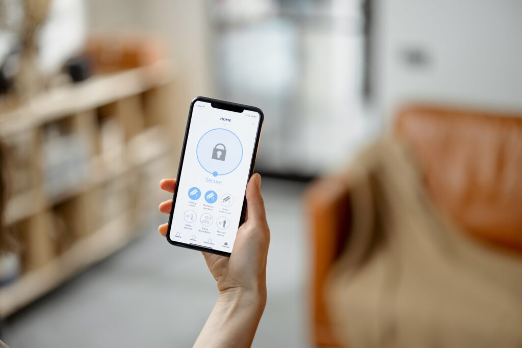 Smartphone with launched application for alarm security - The Security & Technology Digest Guard Tour System
